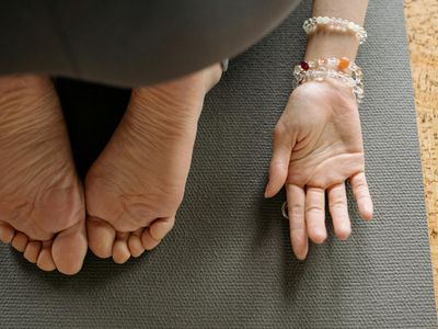 Feet on a mat during a stretching exercise.